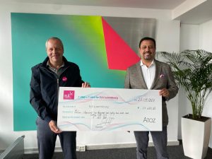 Remise du chèque d'ATOZ à ELA Luxembourg : 1 168 928 pas, soit 11 689,28 €